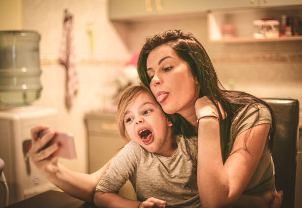 istock Funny face self portrait with Mommy. 904146514