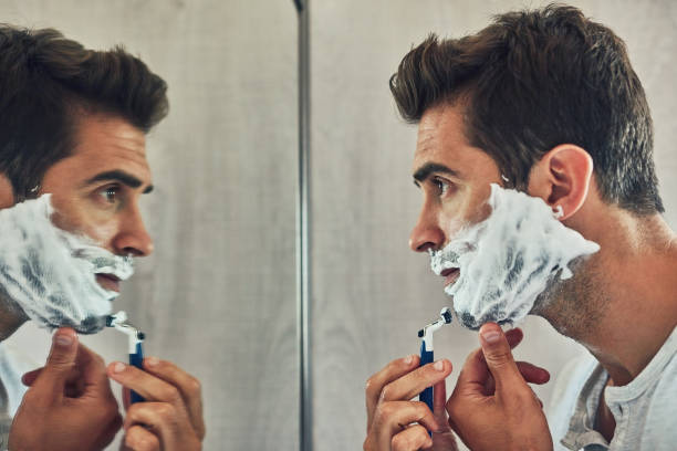 nice and close - shaving men shaving cream mirror imagens e fotografias de stock