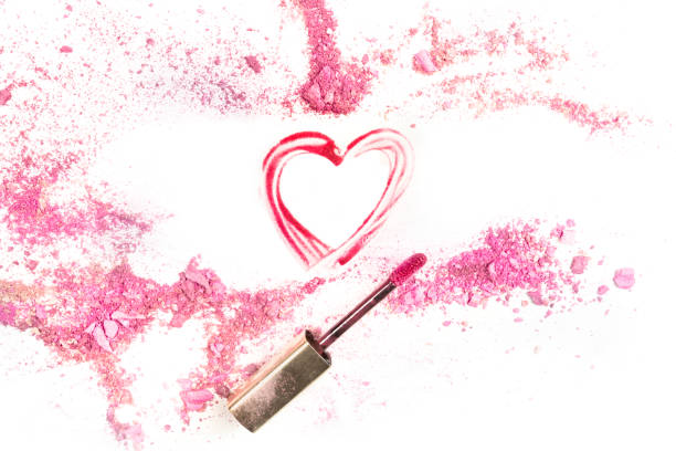 istock Heart drawn with lip gloss on white background with eye shadow 904149554