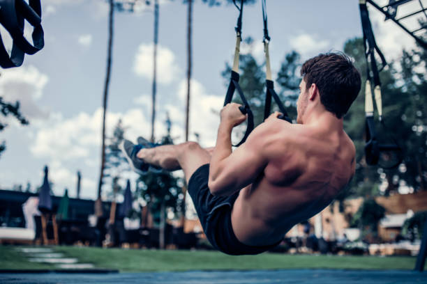 istock Sports man doing suspension training 904150928