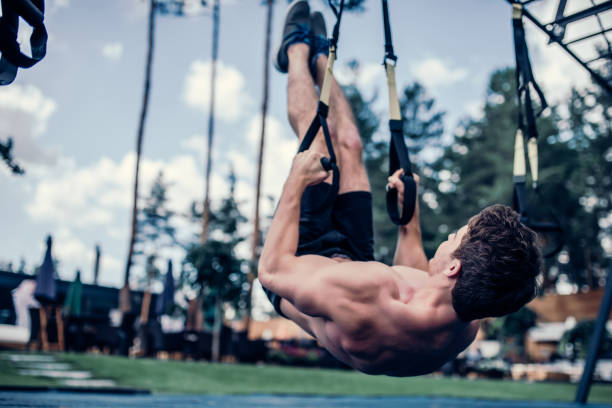 istock Sports man doing suspension training 904150938