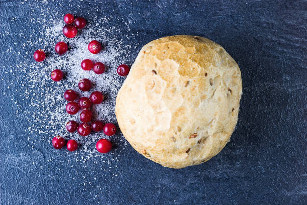 Cranberries in sugar and bun. Directly above. Cranberries in sugar and bun. Directly above. Sweet food. marshwort stock pictures, royalty-free photos & images