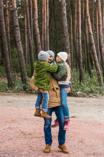 istock father and kids spending time on nature 904158676