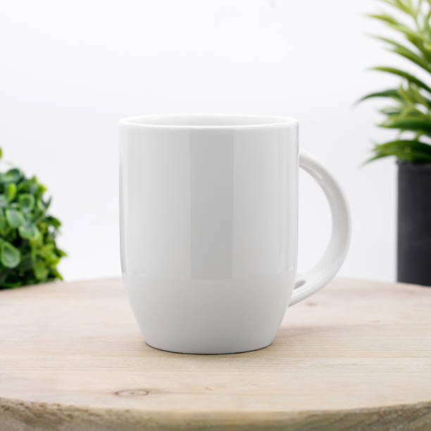 istock Blank coffee mug on wooden shelf. White ceramic cup for your design. 904165718
