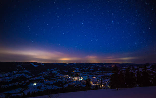 istock Night stars in the snowy mountains 904168286