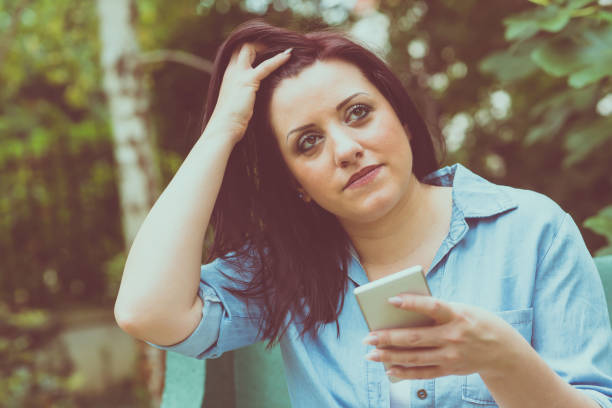 istock Portrait of young woman using her mobile phone 904169496