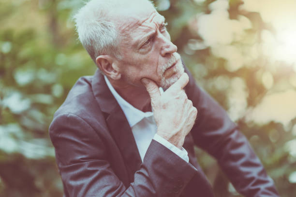 istock Portrait of thoughtful mature man, light effect 904169778
