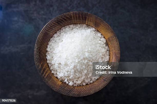 Sea Salt In A Wooden Salt Shaker On Black Background Ingredients For Cooking Stock Photo - Download Image Now
