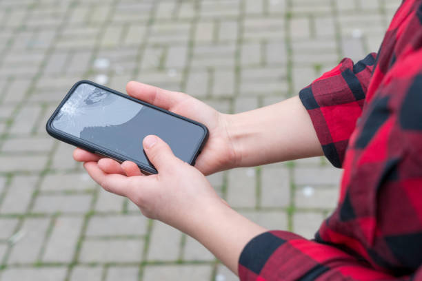 istock Broken phone in a female hand 904172306