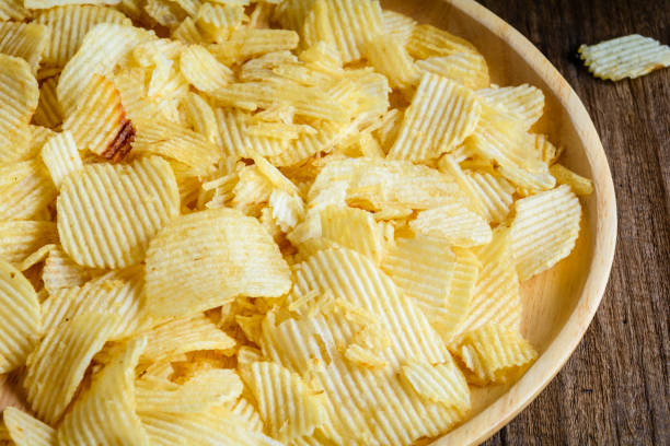 istock Snacks in a wooden dish on a table 904172776