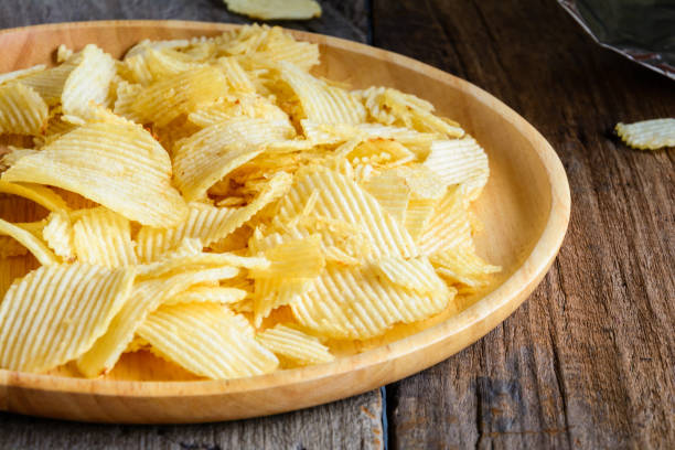 istock Snacks in a wooden dish on a table 904172782