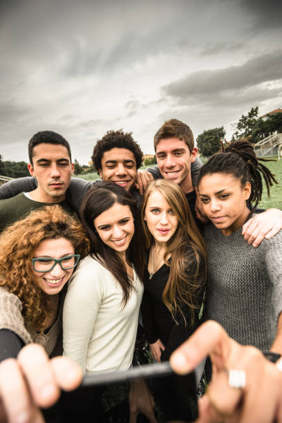 istock friends take a selfie at the park 904182658