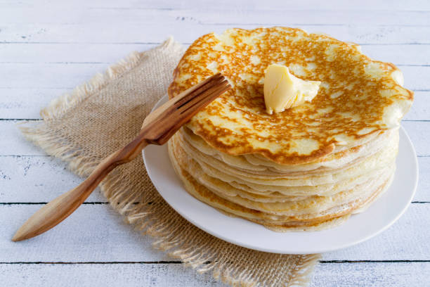 istock Pancakes with butter on a wooden background. 904185646