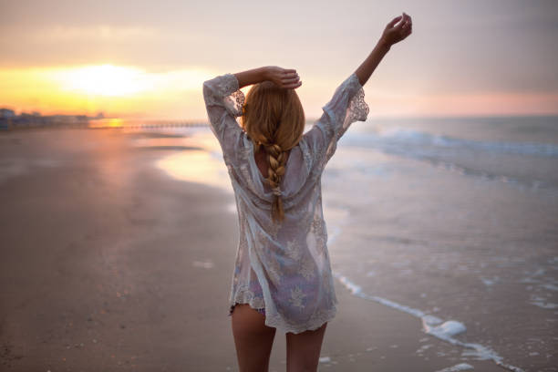 istock Dreamy girl on beach 904186890