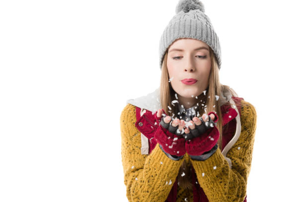 istock girl blowing snow 904187198