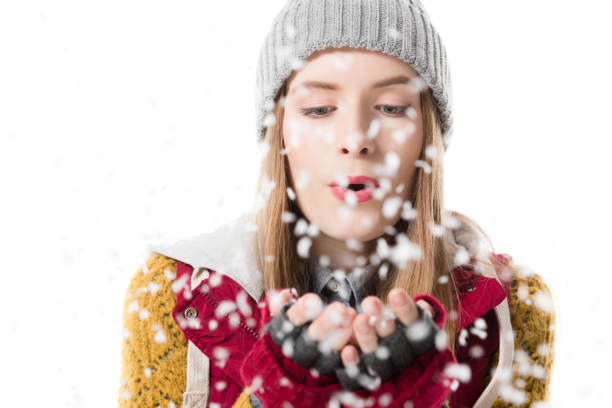 istock girl blowing snow 904187252