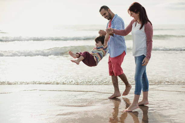 istock A Family Playing On The Beach 904190204