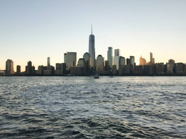 istock Manhattan skyline and ferry at sunset 904190550