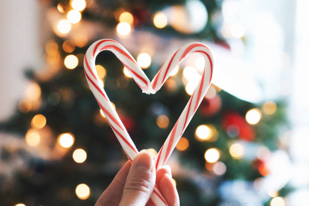 istock Candy canes held up in shape of heart 904190558