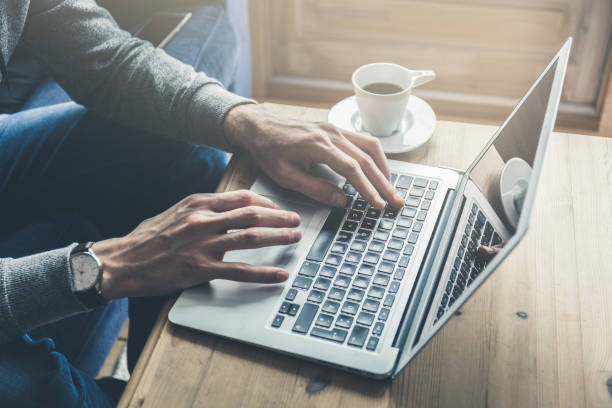 istock Crop person typing on laptop 904190638