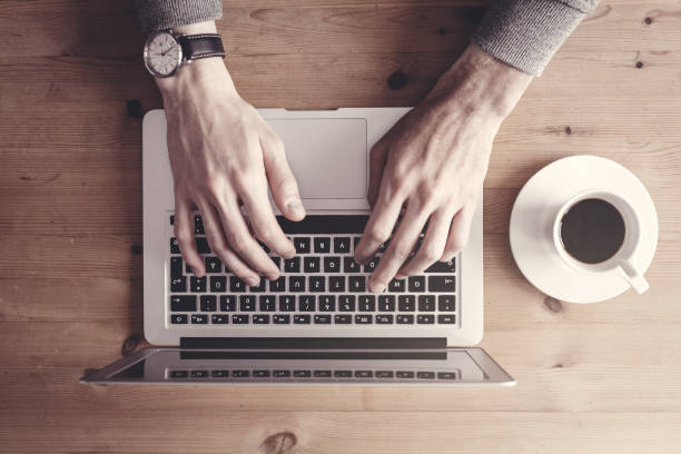 istock From above person typing on laptop 904190796