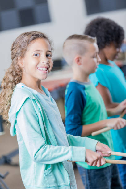 istock Beautiful mixed race girl plays the drums 904190820