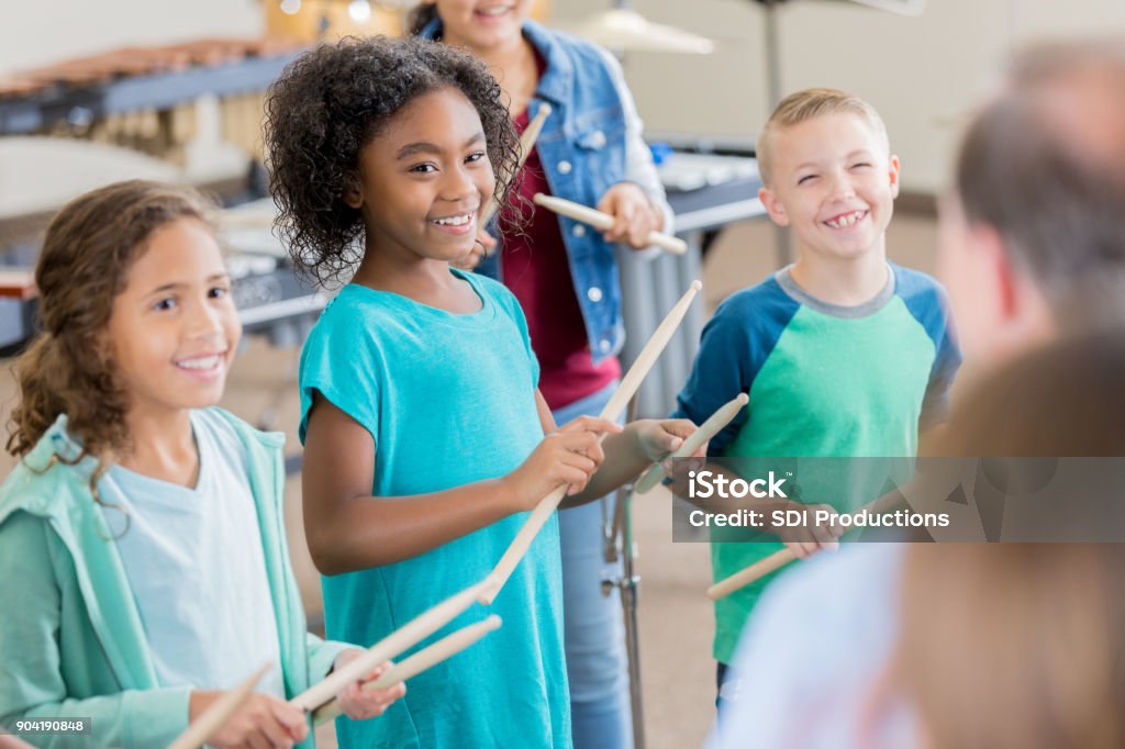 Leaners Playing String Instruments Excited Students Learn To Play Percussion Instruments Stock Photo ...