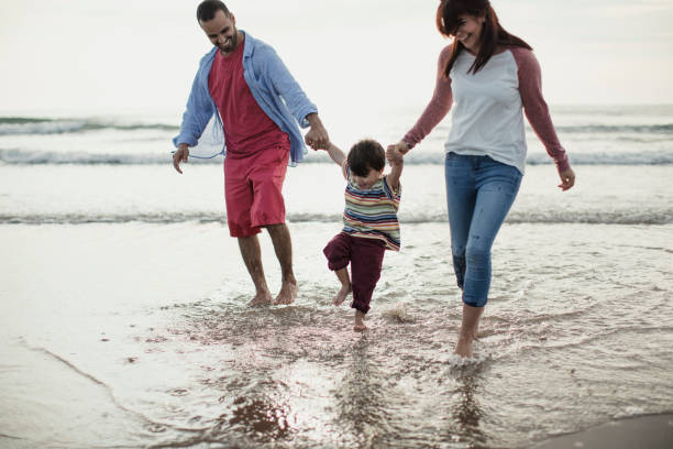 istock A Family Playing On The Beach 904195084