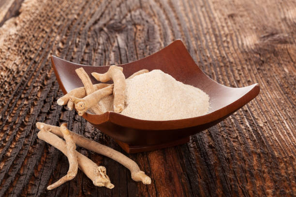 istock Ashwagandha powder in bowl with roots 904196290