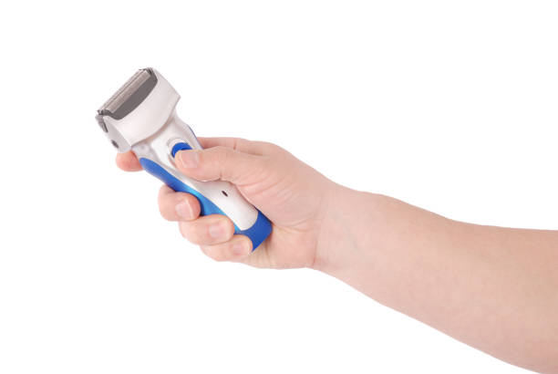 istock Electric shaver holding on hand 904196590