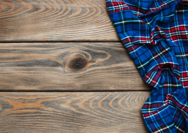 istock Checkered napkin on a wooden background 904200672