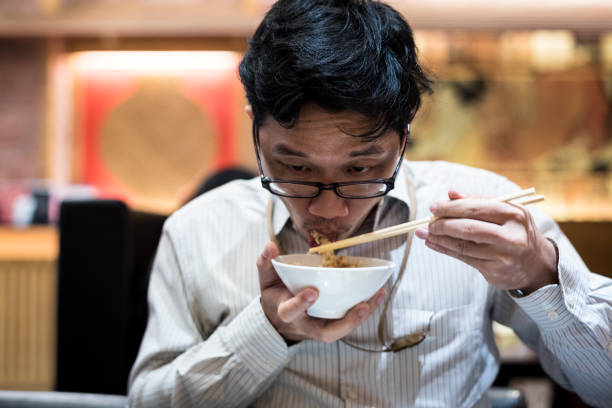 istock portrait man eating grilled. 904201496