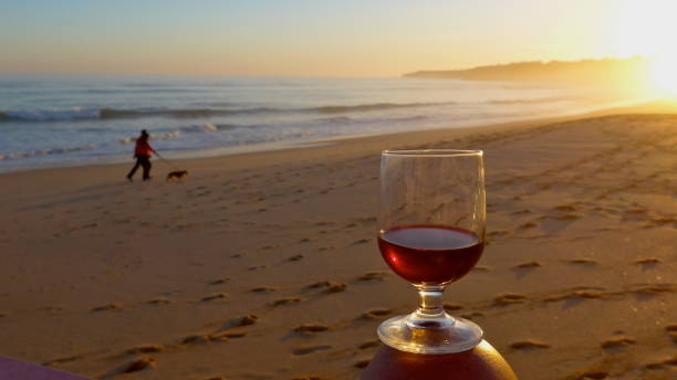 romantic evening moods with a glass of red wine at the sea