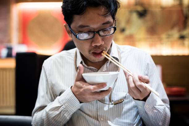 istock portrait man eating grilled. 904208106