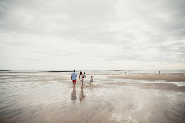 istock A Family Playing On The Beach 904211526