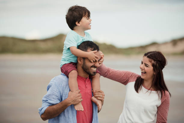 istock A Family Playing On The Beach 904215126