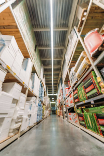 istock blurred view of shelves with boxes in storehouse 904216790