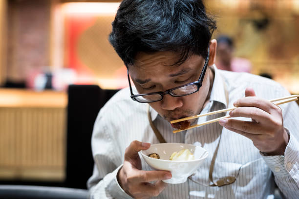 istock portrait man eating grilled. 904220214
