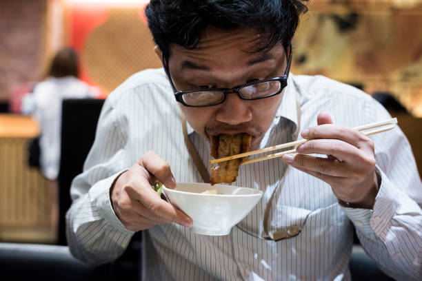 istock portrait man eating grilled. 904223304