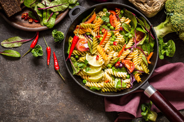 istock pasta salad with fresh herbs spinach, vegetables and green peas 904223968