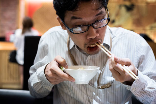 istock portrait man eating grilled. 904225700