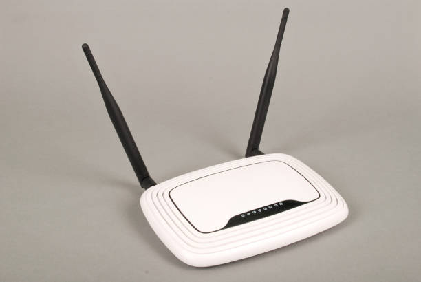 istock White WI-FI router with two antennas 904228546