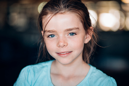 Portrait of young blue eyed girl.