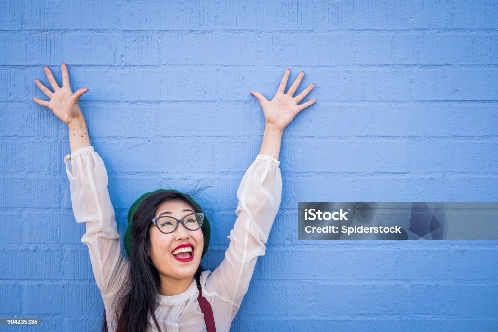 Quirky Asian Young Woman Adorable funny Asian young hipster woman with glasses. Eccentric Stock Photo