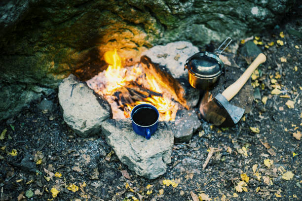istock Camping in the forest. Preparation of breakfast at the stake. 904242450