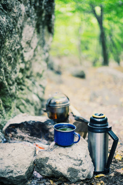 istock Camping in the forest. Preparation of breakfast at the stake. 904242466