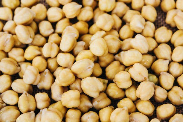 istock Chickpeas on the wooden table. Vegetarian food. 904249024