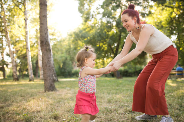 istock Dancing family in the park 904254494
