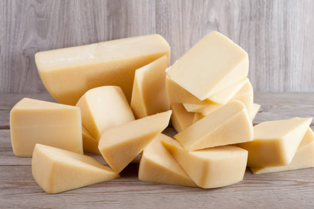 istock Parmesan cheese on wooden background 904260754