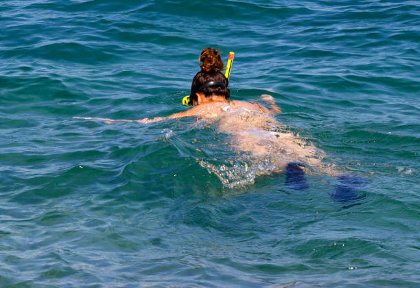 istock Snorkelling girl 904261788